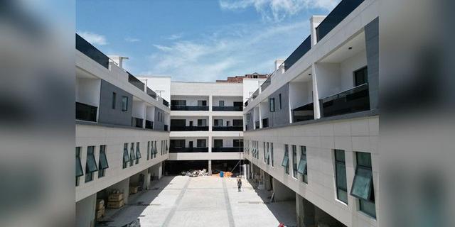 Apartment complex under construction in Lagos, used as an illustrative housing-development image.