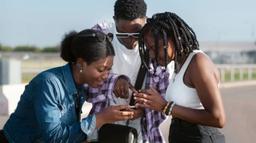 Young Nigerians using smartphones and social media platforms to create content, engage online and explore digital opportunities in a connected world.