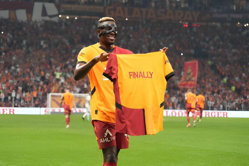 The Nigerian striker celebrated his first goal for the club by showing off a “finally” jersey.
