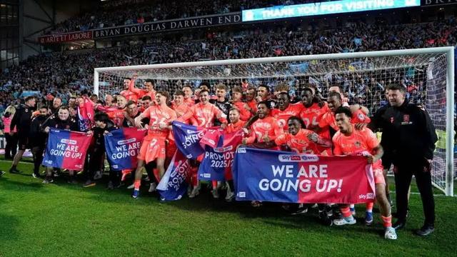 Coventry City players celebrating promotion to the Premier League after a dramatic late equaliser at Ewood Park