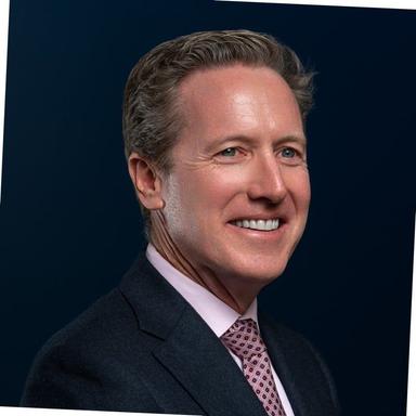 Dangote Refinery complex with oil storage tanks and pipelines under cloudy skies.