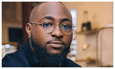 Afrobeats artists Davido and Wizkid alongside DJ Tunez at separate public events.