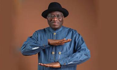 Former Nigerian President Goodluck Jonathan surrounded by supporters during a political consultation in the South-South region.