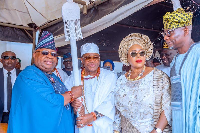 Governor Ademola Adeleke presents the staff of office to Oba Adesuyi Haastrup, the newly installed Owa-Obokun of Ijesaland.