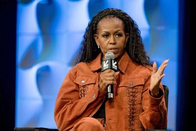 Michelle Obama cautions women against rushing into cohabitating with their partners.
