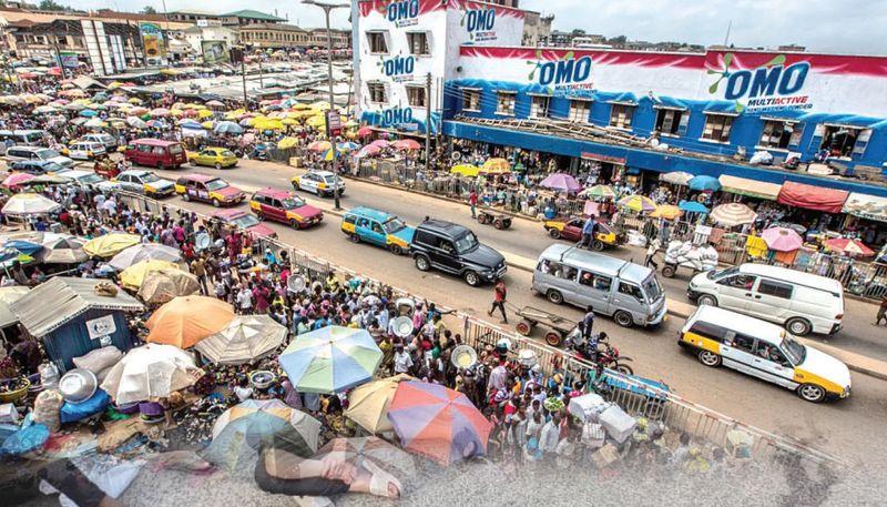Traders at Onitsha Main Market arranging goods and serving customers following a one-week closure in compliance with state directives.