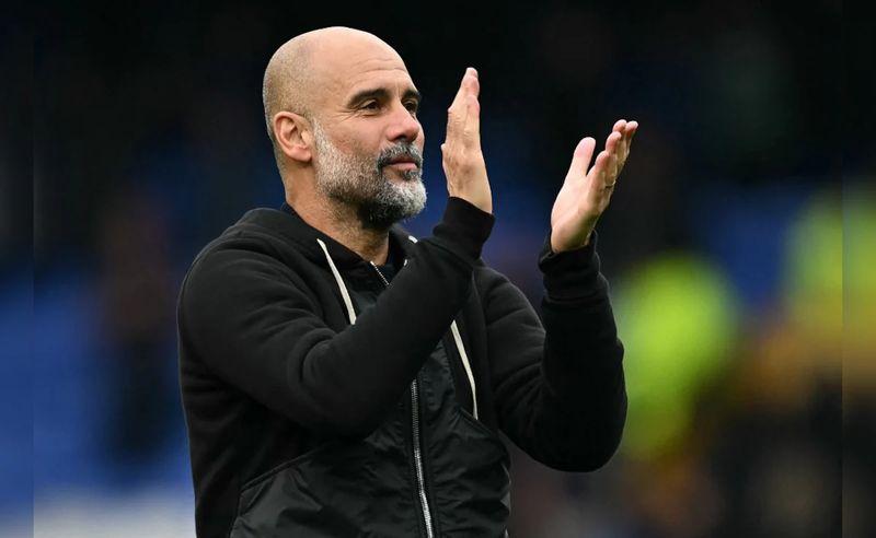 Pep Guardiola speaking on the touchline during a Manchester City match while analysing Arsenal