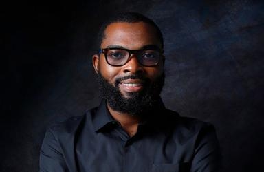 Sheriff Adedokun, CEO of Clea, in a black shirt and glasses.
