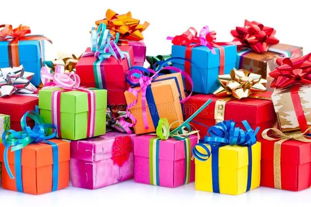 A beautifully arranged collection of lifestyle gifts including a wellness hamper, insulated water bottle, Bluetooth speaker, travel accessories and gift box on a wooden table.