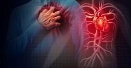 Adult experiencing mild chest discomfort while holding their chest, illustrating common early warning signs of heart disease.
