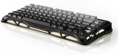 Office worker using keyboard shortcuts while working on a laptop in a modern workspace.
