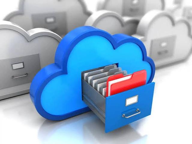 Cloud storage icons displayed across a laptop and smartphone, symbolising secure online file backup and cross-device access.