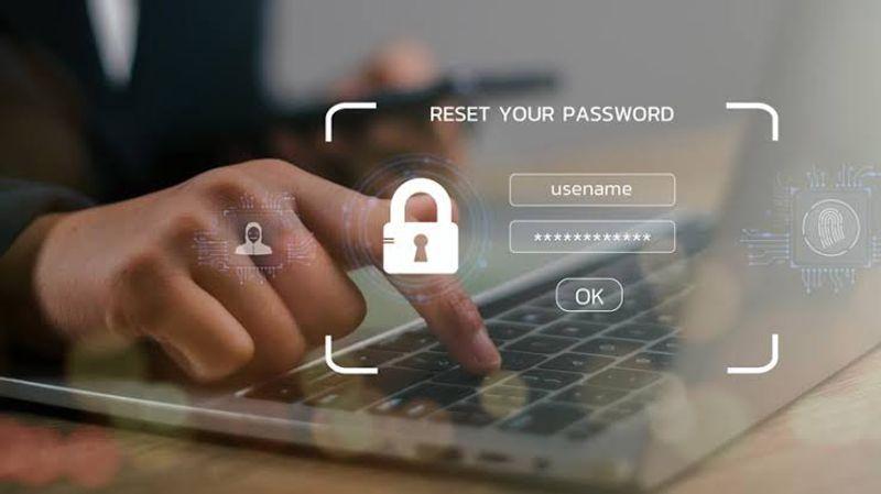 Business team using a password manager to securely access company accounts on laptops and mobile devices.