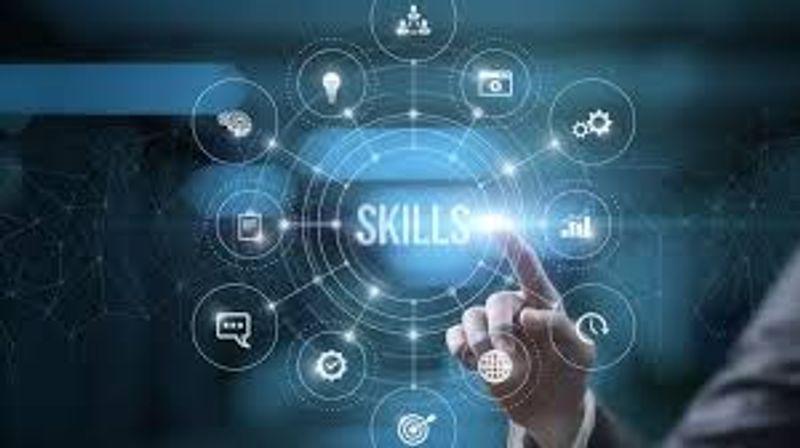 Young professionals using laptops and digital tools while collaborating on data analysis, cybersecurity, AI and digital marketing tasks in a modern office environment.