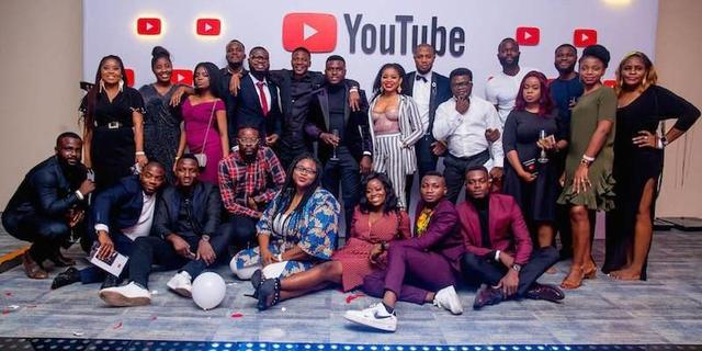 A group of Nigerian creators pose together at a YouTube event.
