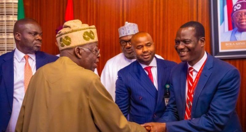 President Bola Tinubu administering the oath of office to Taiwo Oyedele as Minister of State for Finance at the State House.