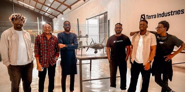Terra Industries team members in a manufacturing setting.