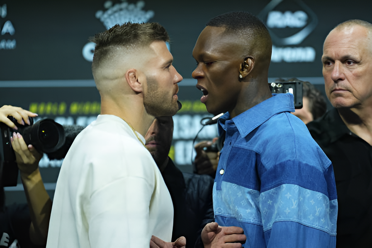 Israel Adesanya and Dricus Du Plessis in an intense face-off during a pre-fight press conference