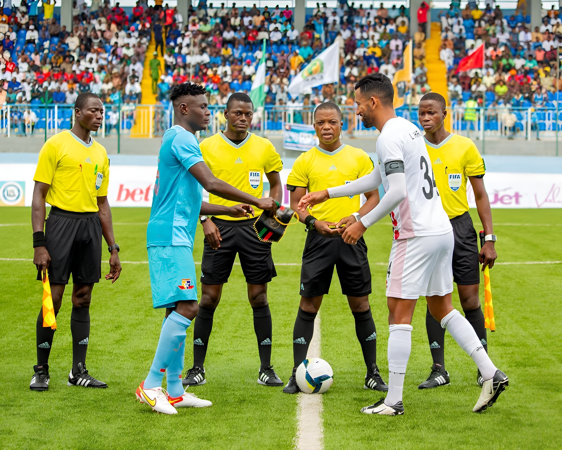 Remo's Stars Captain, Nduka Junior exchanging the captain's band