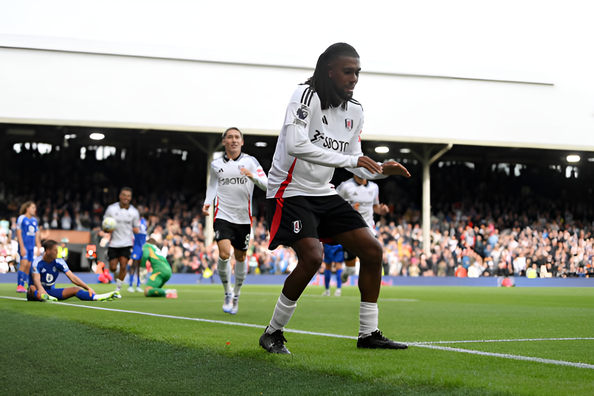 Alex Iwobi celebrates after scoring for Fulham