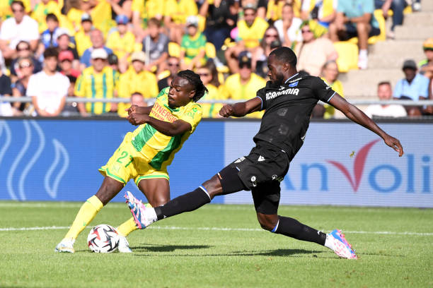 Super Eagles Moses Simon dribbles an FC Auxerre player