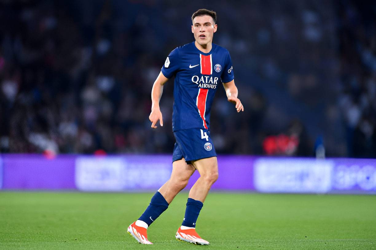 Manuel Ugarte in action for Paris Saint-Germain, showcasing his skills as a midfielder.