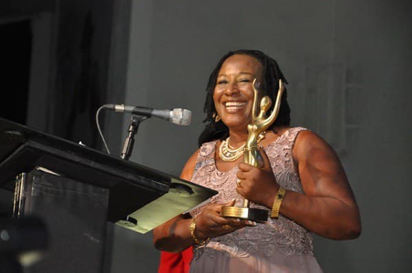 Renowned actress Patience Ozokwor with her Merit Award in 2023
