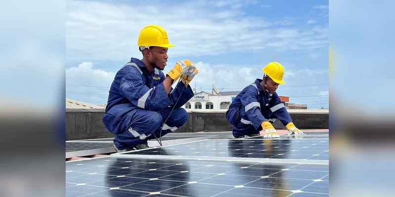 Solar technicians installing panels on a Nigerian rooftop.