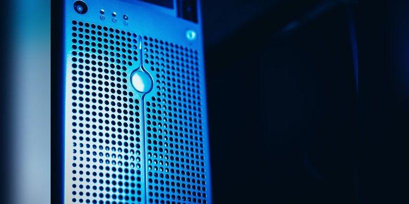 Close-up of a blue-lit server rack in a data centre, used as illustrative infrastructure imagery