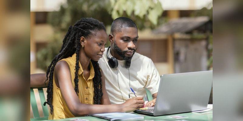 Nigerian students using smartphones and mobile internet at a study session.