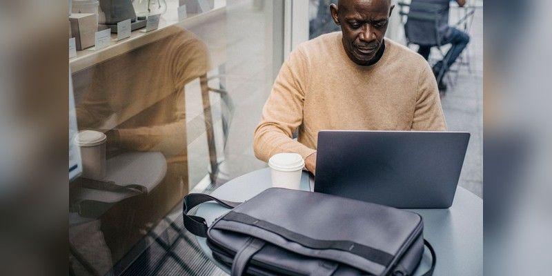 Entrepreneur working on a laptop at a table in a café