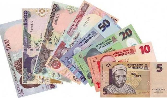 Nigerian naira banknotes displayed alongside US dollar notes, illustrating the currency’s recent appreciation amid improved foreign-exchange liquidity.