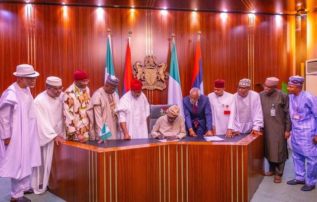 President Bola Ahmed Tinubu signing the Electoral Act 2026 (Amendment) at the Presidential Villa, Abuja.