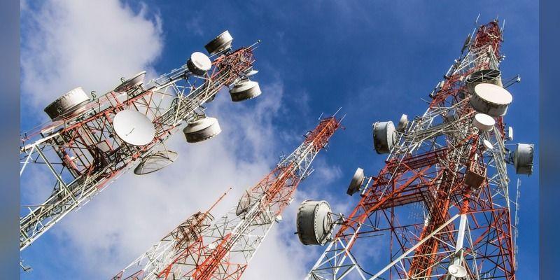 Telecommunications masts against a blue sky, illustrating Nigeria’s internet-data infrastructure.
