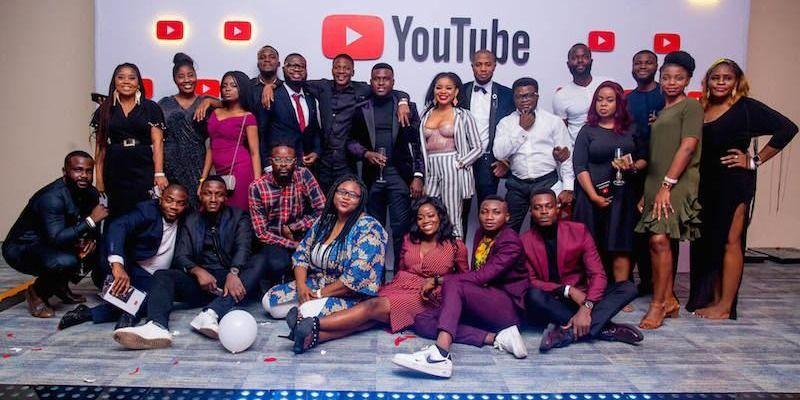 A group of Nigerian creators pose together at a YouTube event.