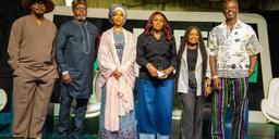 PodFest Naija 2025 storytellers and creators pose on stage at Harbour Point in Lagos.