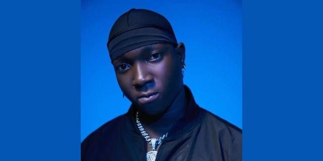 Nigerian singer T.I Blaze in a blue-lit promotional portrait.